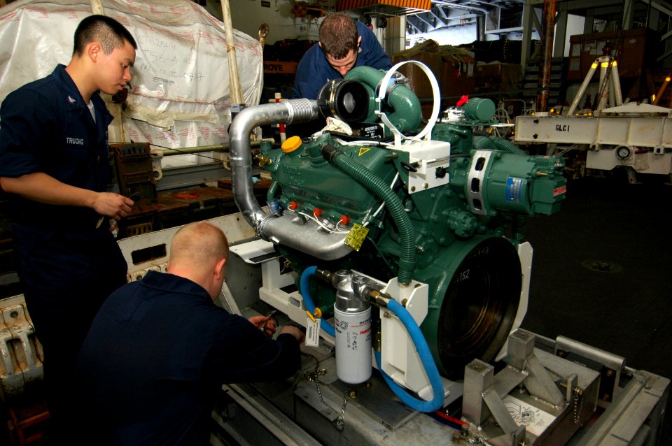 US Navy 070803-N-5387K-001 Sailors work on a fire fighting truck's diesel engine outside the ground support equipment (GSE) shop aboard USS Kitty Hawk (CV 63)