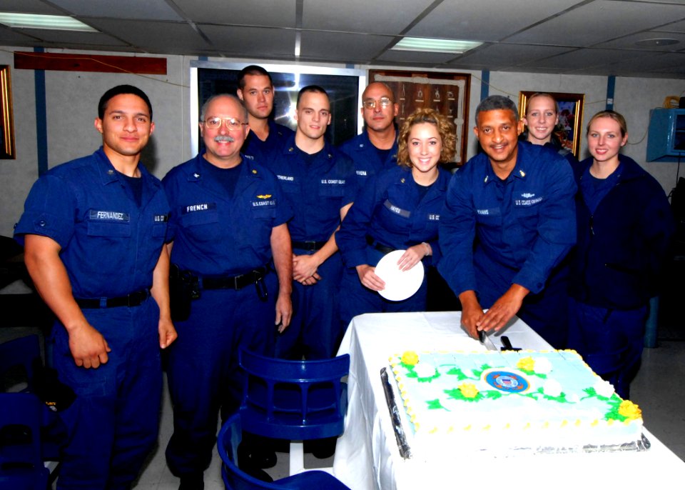US Navy 070804-N-8704K-010 Senior Chief Health Service Technician Christopher Evans, along with the U.S. Coast Guard medical team stationed aboard the Military Sealift Command (MSC) hospital ship USNS Comfort (T-AH 20), cuts a