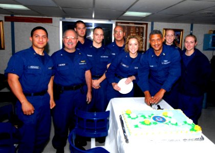 US Navy 070804-N-8704K-010 Senior Chief Health Service Technician Christopher Evans, along with the U.S. Coast Guard medical team stationed aboard the Military Sealift Command (MSC) hospital ship USNS Comfort (T-AH 20), cuts a
