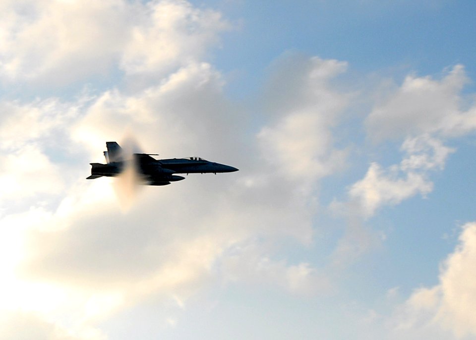 US Navy 070801-N-6854D-001 An F-A-18C Hornet assigned to the Wildcats of Strike Fighter Squadron (VFA) 131 breaks the sound barrier during an aerial demonstration for the Sailors aboard the Nimitz-class aircraft carrier USS Dwi