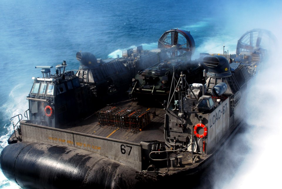 US Navy 070731-N-5307M-004 A Landing Craft, Air Cushion (LCAC) transports equipment from Marine Expeditionary Unit (MEU) 22 to the amphibious dock landing ship USS Gunston Hall (LSD 44)