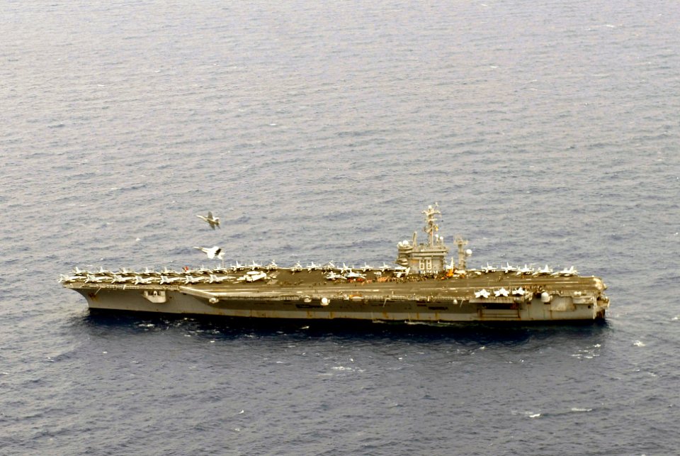 US Navy 070801-N-6326B-065 Capt. Thomas Downing, Commander, Carrier Air Wing (CVW) 11, and Capt. David Woods perform a fly-by over of nuclear-powered aircraft carrier USS Nimitz (CVN 68)