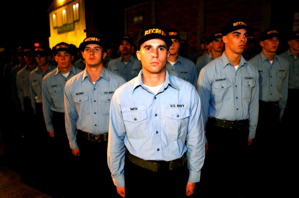 US Navy 070803-N-3642E-167 Recruits stand at attention during their capping ceremony after successfully completing Battle Stations 21 aboard USS Trayer (BST 21)