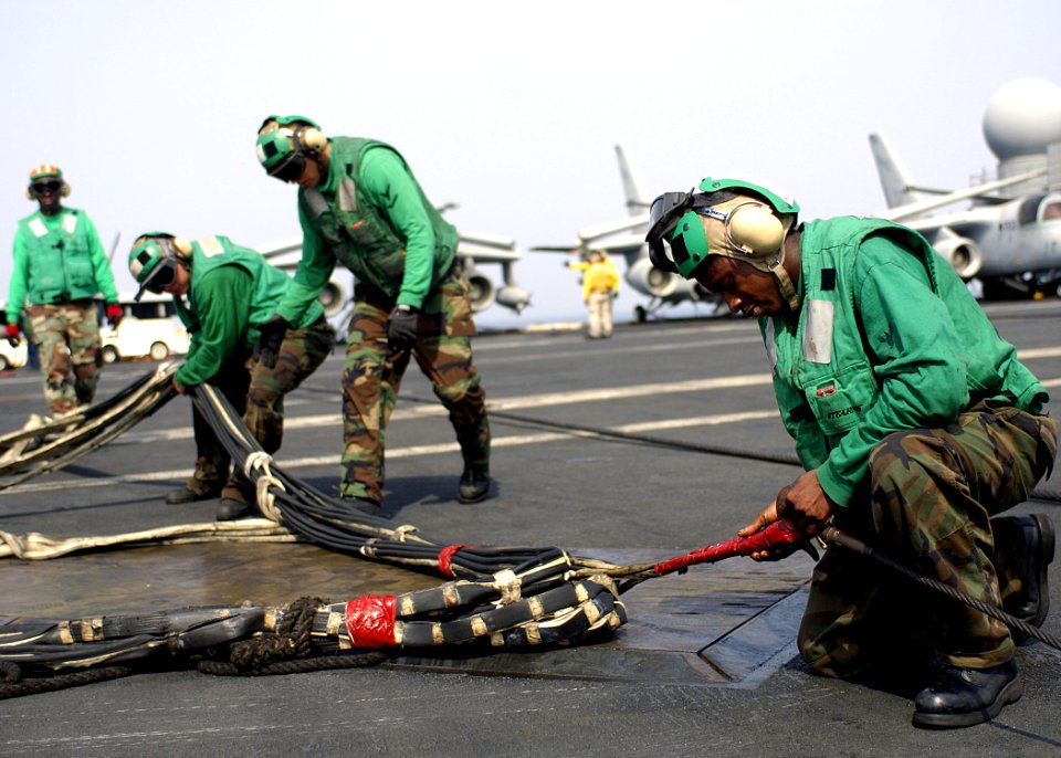 US Navy 070804-N-1598C-052 Sailors of V-2 division connect the barricade to its station during flight deck drills aboard the nuclear-powered aircraft carrier USS Enterprise (CVN 65)