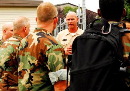 US Navy 070806-N-4515N-004 Sailors assigned to Mobile Diving and Salvage Unit (MDSU) 2 from Naval Amphibious Base Little Creek, Va., receive instructions from Chief Warrant Officer Daniel Mikulski