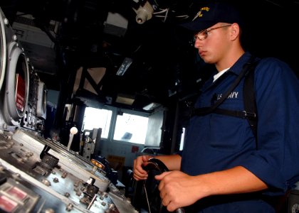 US Navy 070807-N-5928K-003 Seaman Jeremy Cantrel stands the helm watch on the navigation bridge of the guided-missile cruiser USS Gettysburg (CG 64)