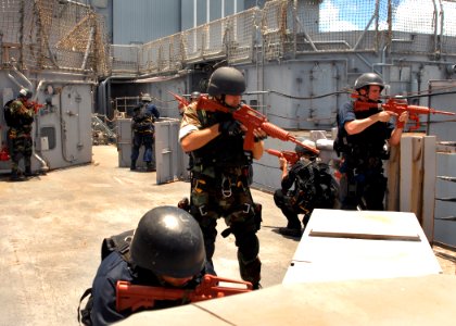 US Navy 070802-N-5476H-106 Students of the Ship's Reaction Force-Advanced Class secure the deck of the decommissioned ship Cushing during an exercise at Pearl Harbor, Hawaii