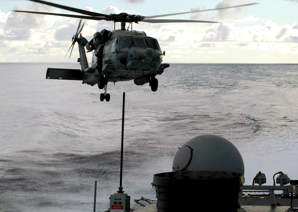 US Navy 070806-N-2638R-001 An HH-60H Seahawk helicopter assigned to the Chargers of Helicopter Squadron (HS) 14, prepares to land on the flight deck of Arleigh Burke-class guided-missile destroyer USS John S. McCa