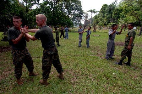 US Navy 070807-N-0989H-158 Task Group 40.9 Marines demonstrate Body Hardening, Pad Drills and Unarmed Manipulations for their Guatemalan Counterparts on the Puerto Barrios Naval Station