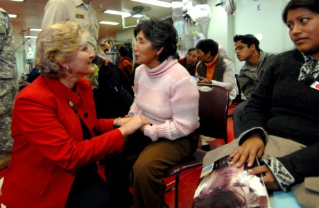 US Navy 070808-N-0194K-037 Under Secretary of State for Diplomacy and Public Affairs, Karen Hughes, speaks with Peruvian patients awaiting medical treatment aboard the Military Sealift Command hospital ship USNS Comfort (T-AH