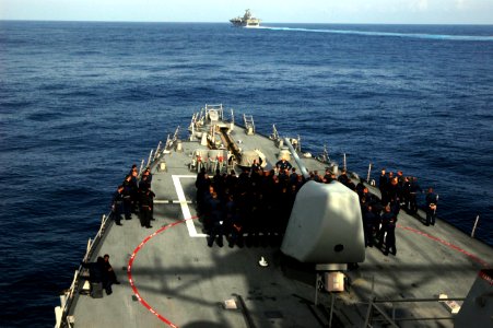 US Navy 070807-N-4014G-199 Cmdr. Robert Hall Jr., commanding officer of the guided missile destroyer USS Porter (DDG 78), conducts an all hands call on the foc'sle as the amphibious assault ship USS Kearsarge (LHD 3)