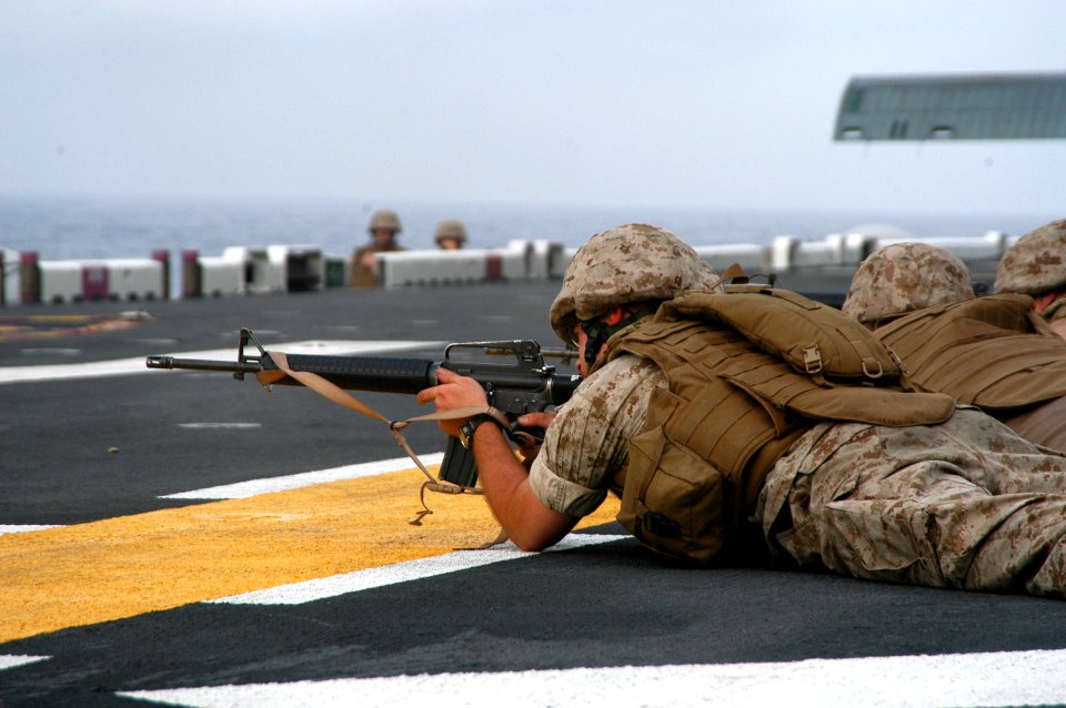 US Navy 070806-N-7955L-039 A U.S. Marine attached to Marine Expeditionary Unit (MEU) 22 participates in a live-fire exercise on the flight deck of the amphibious assault ship USS Kearsarge (LHD 3)