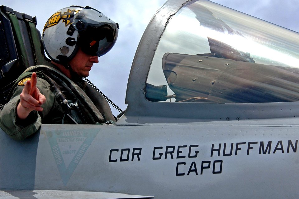 US Navy 070804-N-7883G-041 Cmdr. Greg Huffman completes his pre-flight checks in an F-A-18E Super Hornet before an aerial change of command for the Strike Fighter Squadron (VFA) 27 on USS Kitty Hawk (CV 63)