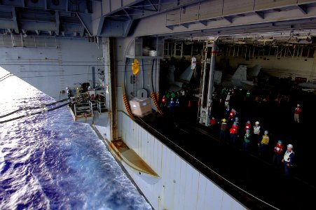 US Navy 070806-N-7883G-014 Sailors aboard the USS Kitty Hawk (CV 63), send cargo to the Military Sealift Command oiler USNS John Ericsson (T-AO 194) during a refueling at sea (RAS)