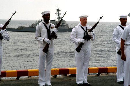 US Navy 070805-N-7955L-111 Sailors from the amphibious assault ship USS Kearsarge (LHD 3) prepare to render honors during a burial at sea ceremony