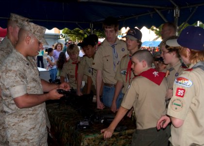 US Navy 070807-N-0483B-005 Members of the 2nd Fleet Antiterrorism Security Team (FAST), 3rd Platoon demonstrate to Boy Scout troop 35 proper weapon handling during the 24th Annual National Night Out photo