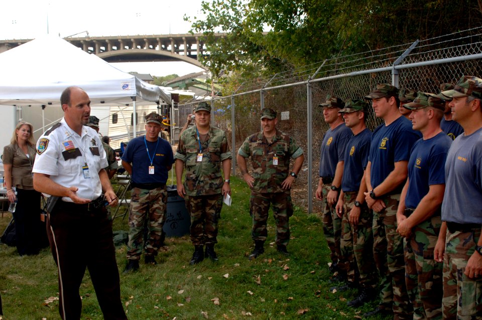 US Navy 070808-N-3093M-019 Hennepin County Sheriff Richard Stanek congratulates the new chief selects and thanks the Sailors of Mobile Diving and Salvage Unit (MDSU) 2 for their efforts in aiding with the disaster relief