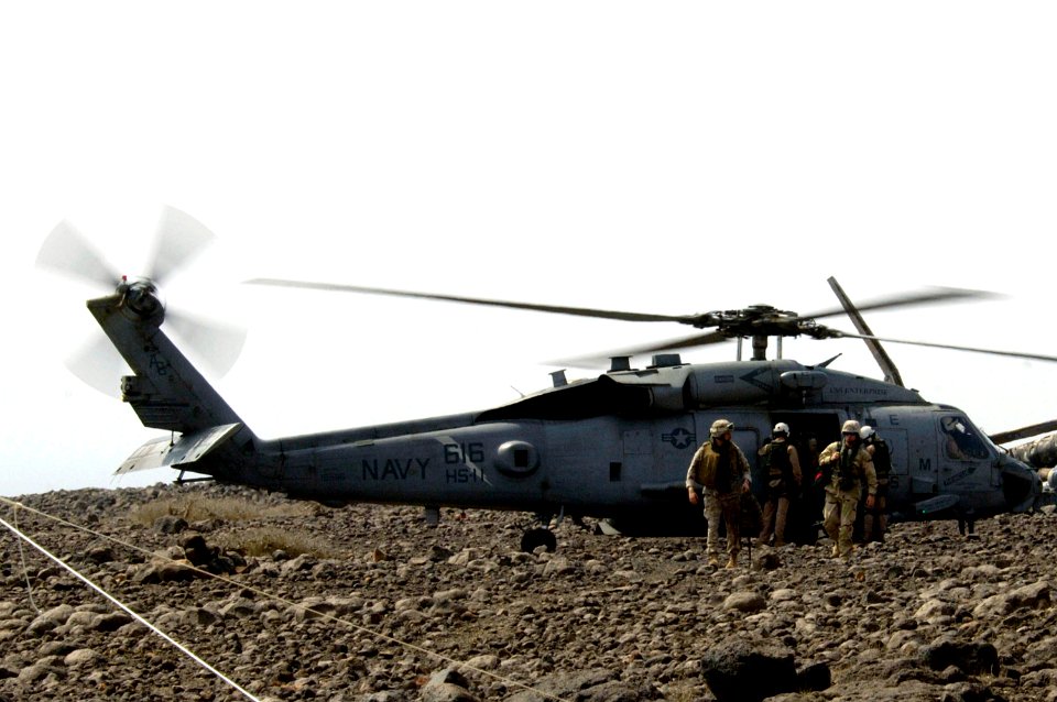 US Navy 070806-F-5427L-013 A Navy SH-60F Seahawk helicopter attached to the nuclear-powered aircraft carrier USS Enterprise (CVN 65) drops military members off at the command post for bombing exercise