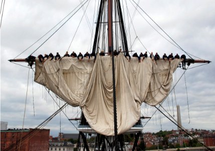 US Navy 070806-N-5690S-001 USS Constitution crew members practice setting and furling the ship's main topsail in preparation for the Chief Petty Officer selectee events held aboard every year during the last two weeks of