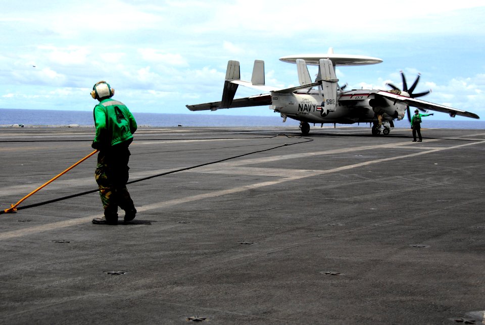 US Navy 070807-N-9760Z-023 Aviation Boatswain's Mate (Equipment) Airman Albert Guzman helps retract the arresting gear on the flight deck of the nuclear-powered aircraft carrier USS Nimitz (CVN 68)