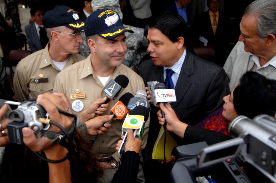 US Navy 070807-N-0194K-351 The Military Sealift Command (MSC) hospital ship USNS Comfort (T-AH 20), Mission Commander Capt. Bob Kapcio along with Daniel Martinez, listens to questions asked by local media