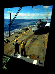 US Navy 070809-N-0684R-005 A Landing Signaling Enlisted, signals the pilot of an SH-60B Seahawk assigned to the