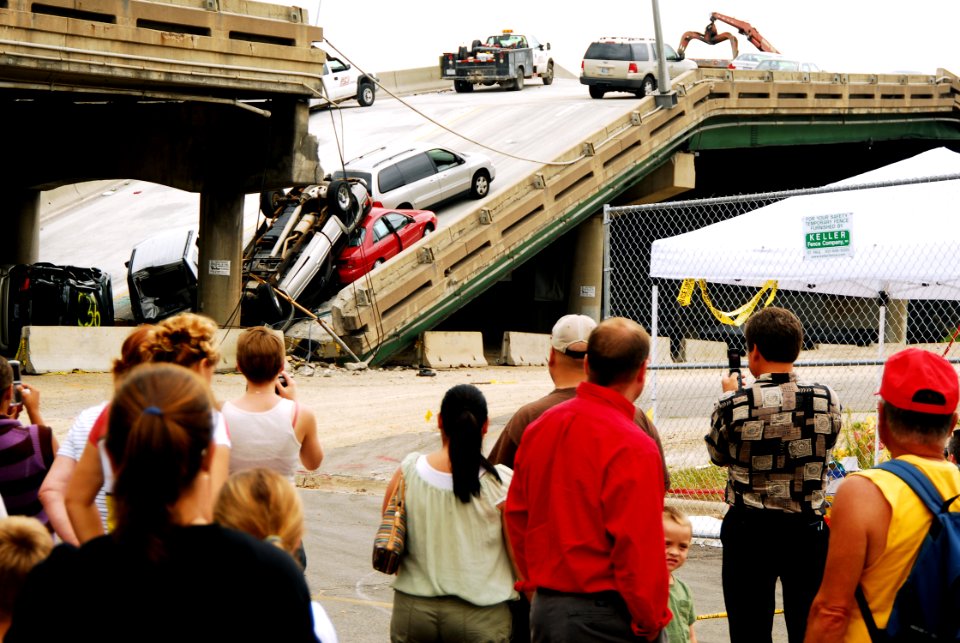 US Navy 070809-N-4515N-123 People gather to view the damage at the I-35 bridge collapse site