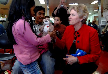 US Navy 070808-N-0194K-018 Under Secretary of State for Diplomacy and Public Affairs, Karen Hughes, gives Peruvian children awaiting medical treatment aboard the Military Sealift Command (MSC) hospital ship USNS Comfort (T-AH 2