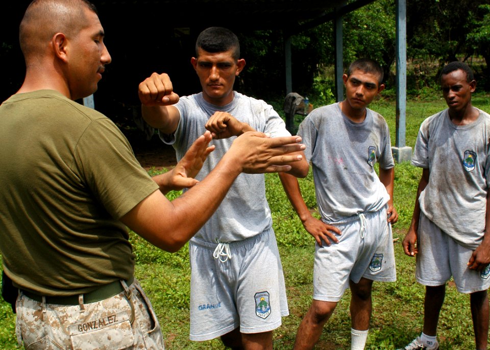 US Navy 070808-N-4021H-123 Gunnery Sgt. Octavio Gonzalez assigned to the dock landing ship USS Pearl Harbor (LSD 52), demonstrates proper self defense striking techniques for Honduran Sailors