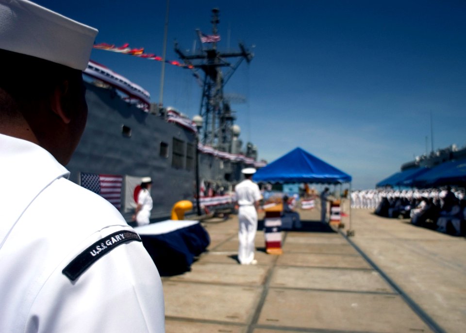 US Navy 070809-N-5253W-001 Sailors stationed aboard the Oliver Hazard Perry-class guided-missile frigate USS Gary (FFG 51) look on during a pier-side farewell ceremony