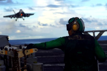 US Navy 070808-N-2659P-078 Aviation Boatswain's Mate (Equipment) Dennis Archer from air department, prepares to assist as an F-A-18F Super Hornet assigned to the Black Knights of Strike Fighter Squadron (VFA) 154