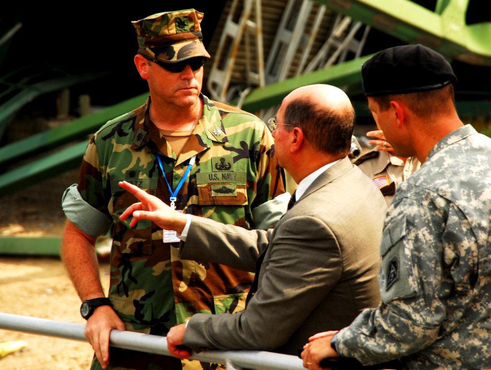 US Navy 070808-N-4515N-152 Secretary of the Navy (SECNAV) the Honorable Donald C. Winter, center, meets with Department of Defense, federal, state, and local officials at the scene of the I-35 bridge collapse