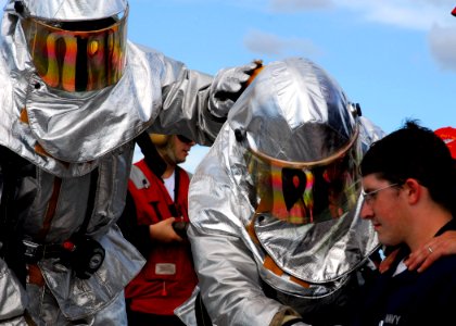 US Navy 070808-N-2638R-009 Sailors wearing hot suits check on a crash victim during a crash and smash (helicopter crash) drill during Valiant Shield 2007