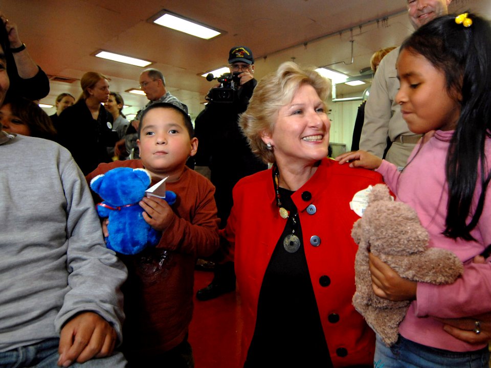 US Navy 070808-N-0194K-027 Under Secretary of State for Diplomacy and Public Affairs, Karen Hughes, gives Peruvian children awaiting medical treatment aboard the Military Sealift Command (MSC) hospital ship USNS Comfort (T-AH 2