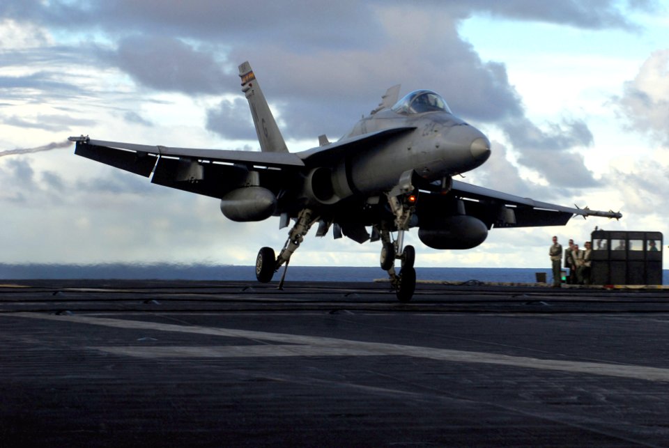 US Navy 070808-N-2659P-116 An F-A-18C Hornet from the Death Rattlers of Marine Fighter Attack Squadron (VMFA) 323, assigned to Carrier Air Wing (CVW) 9, lands on the flight deck of the Nimitz-class aircraft carrier USS John C