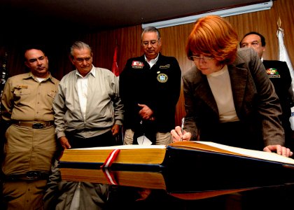 US Navy 070809-N-6278K-166 Caryn Hollis, U.S. Southern Command's director of joint interagency partnering, signs a guest book at Trujillo Regional Teaching Hospital photo