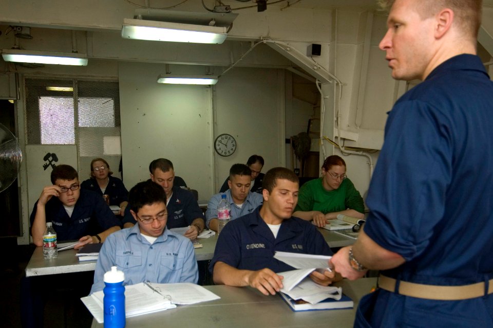 US Navy 070809-N-5387K-003 he Ship's Psychologist, Lt. Justin D'Arienzo teaches a psychology class aboard the USS Kitty Hawk (CV 63)
