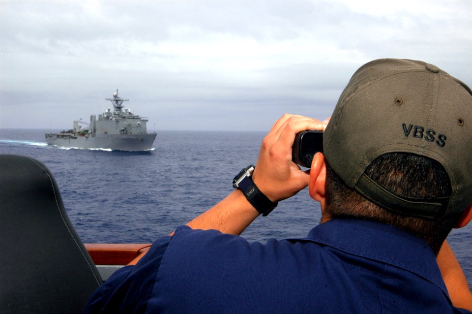US Navy 070808-N-4014G-013 Lt. j.g Edward Stevenson uses a laser range-finder aboard the guided missile destroyer USS Porter (DDG 78)
