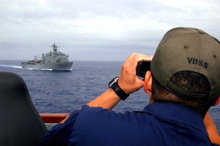 US Navy 070808-N-4014G-013 Lt. j.g Edward Stevenson uses a laser range-finder aboard the guided missile destroyer USS Porter (DDG 78)