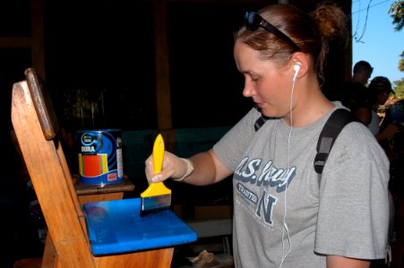 US Navy 070808-N-7029R-032 Seaman Johnson helps painting chairs during a community relations project held at the Profesor Domingo Flores Mejilla School, in support of Partnership of the Americas (POA) 2007