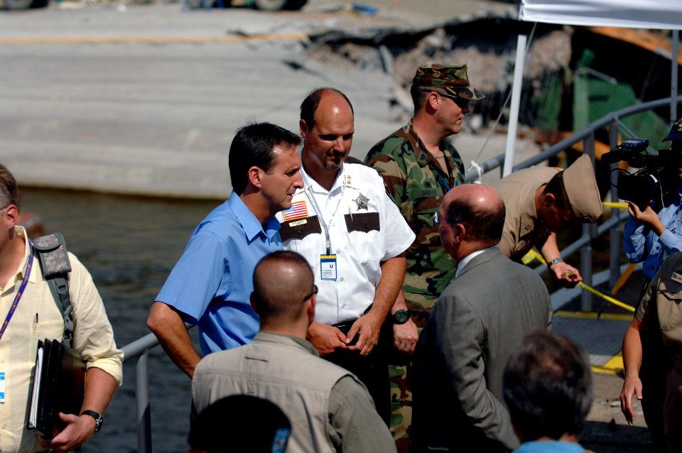 US Navy 070808-N-3642E-417 Secretary of the Navy (SECNAV) the Honorable Dr. Donald C. Winter meets with the Minnesota Governor Tim Pawlenty at the site of the fatal Interstate 35W bridge collapse