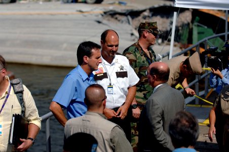 US Navy 070808-N-3642E-417 Secretary of the Navy (SECNAV) the Honorable Dr. Donald C. Winter meets with the Minnesota Governor Tim Pawlenty at the site of the fatal Interstate 35W bridge collapse