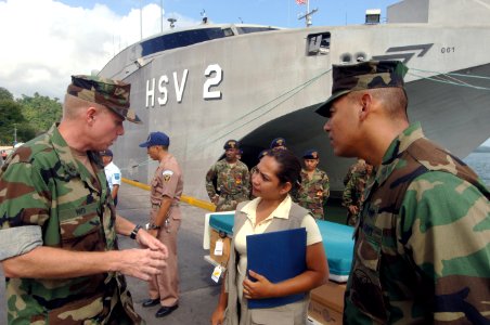 US Navy 070809-N-0989H-016 Commander Task Group (TG) 40.9, Capt. Douglas Wied speaks to Guatemalan media about the medical supplies that were donated by Project Handclasp for area hospitals photo