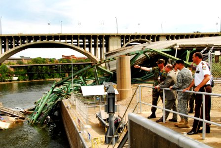 US Navy 070808-N-4515N-153 Secretary of the Navy (SECNAV) the Honorable Donald C. Winter, tours the site of the I-35 bridge collapse
