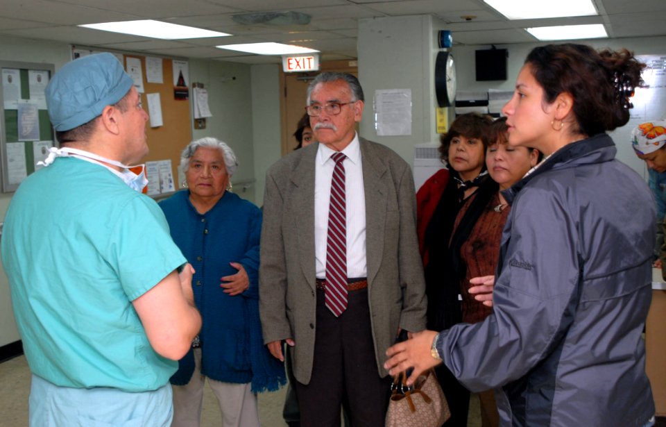 US Navy 070810-N-6081J-026 HM1 Fausto Munoz (left), acts as tour guide for HM1 Wanda Ziehr (right) and her family aboard USNS Comfort