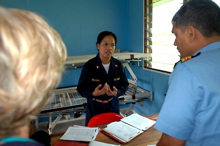 US Navy 070808-N-9421C-022 Lt. Cmdr. Leila Williams attached to Naval Health Clinic Hawaii, briefs her staff on patient movement for medical treatment at Bunabun Health Center, in Madang, Papua New Guinea photo