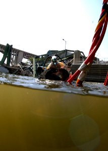 US Navy 070811-N-3093M-011 Chief Navy Diver Scott Maynard attached to Mobile Diving and Salvage Unit (MDSU) 2 from Naval Amphibious Base Little Creek, Va., prepares to leave the surface on a salvage dive in the Mississippi Rive