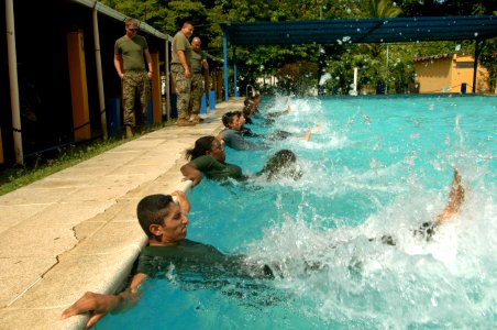 US Navy 070810-N-0989H-119 U.S. Marines assigned to a mobile training team observe Guatemalan sailors and marines conduct a series of aqua aerobics and exercises during Small Unit Tactics training