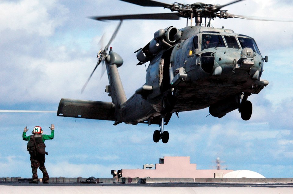 US Navy 070814-N-3136P-034 An HH-60H Seahawk attached to the Chargers of Helicopter Squadron (HS) 14 is cleared for launch from USS Kitty Hawk (CV 63) flight deck prior to Valiant Shield's photograph exercise