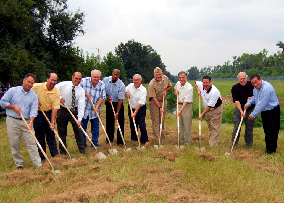 US Navy 070810-N-7427G-001 Capt. Walter J. Adelmann along with members of the Plaquemines Parish City Council break ground on a new drainage system located near Naval Air Station, Joint Reserve Base, New Orleans